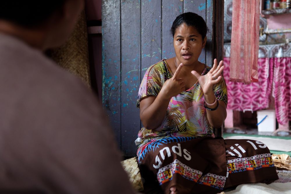 Ledua Naika, a deaf woman in Fiji communicating with sign language.